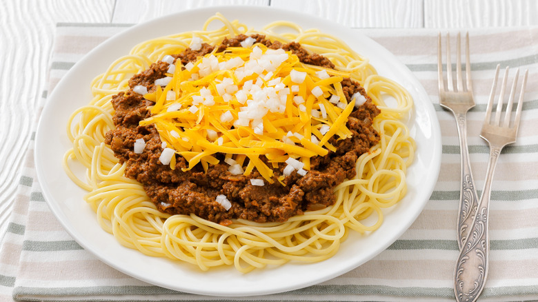 Bowl of Cincinnati chili atop spaghetti noodles