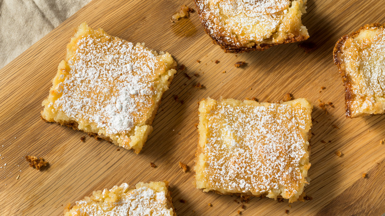 Squares of gooey butter cake on a tray