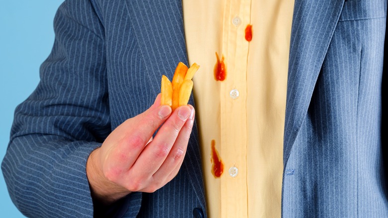 Man with ketchup on shirt