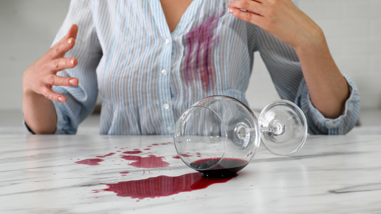 Woman with wine on shirt