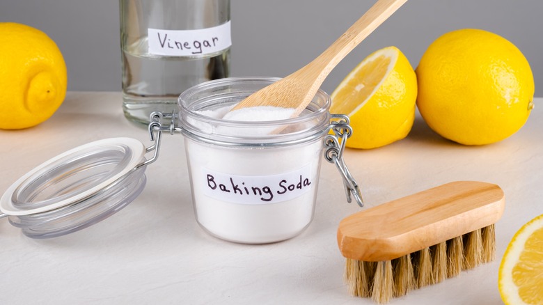 Baking soda, vinegar, lemons, brush