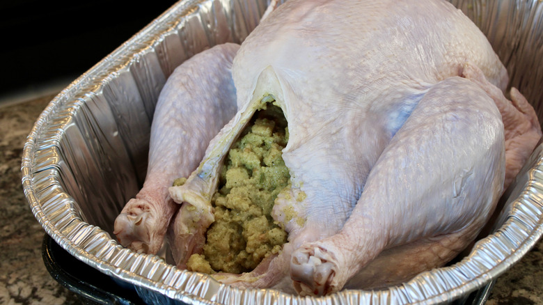 Raw turkey stuffed with stuffing