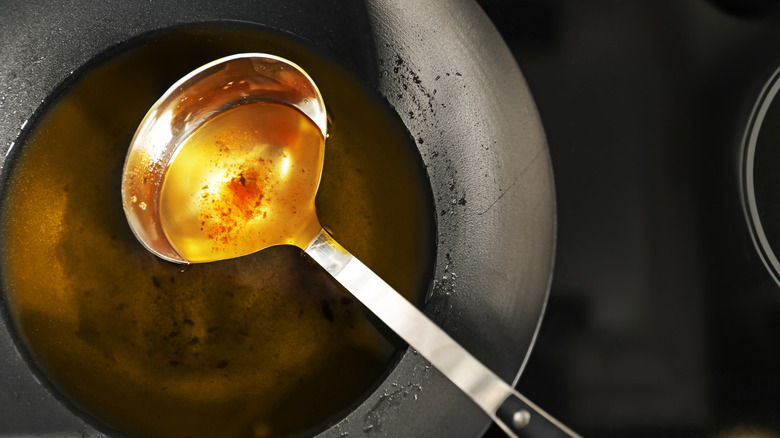 Ladle with used frying oil