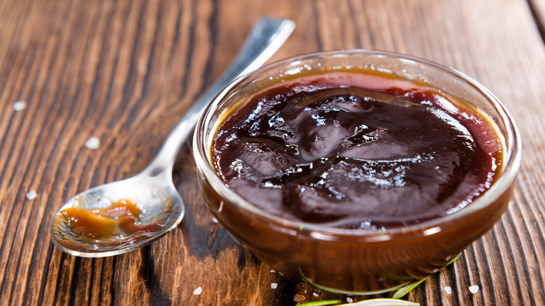 Dish of barbecue sauce with spoon