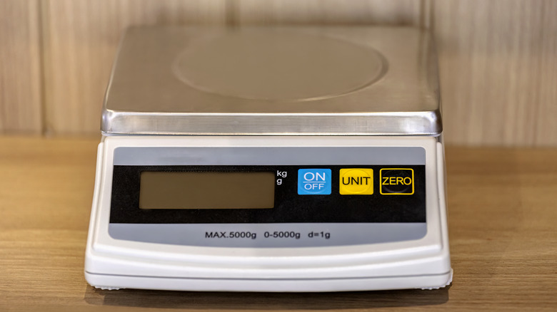 digital scale on wooden countertop