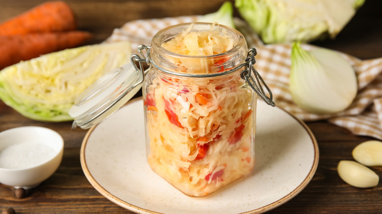 open jar of sauerkraut sitting on table