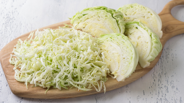 shredded cabbage on cutting board
