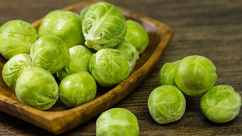 Brussels sprouts in wooden bowl