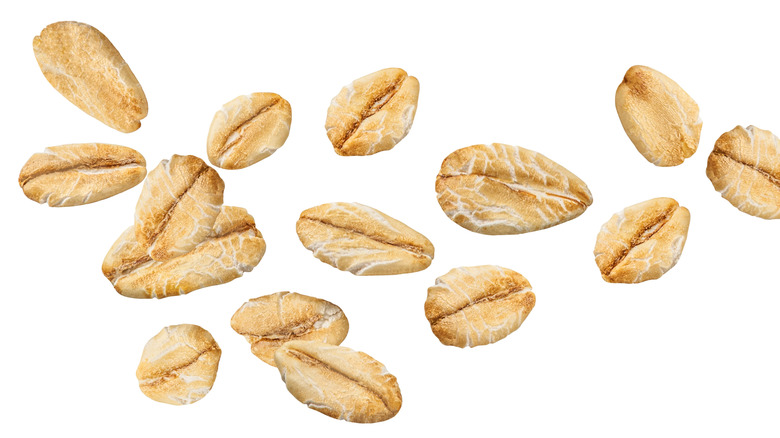 Scattered oats on white background