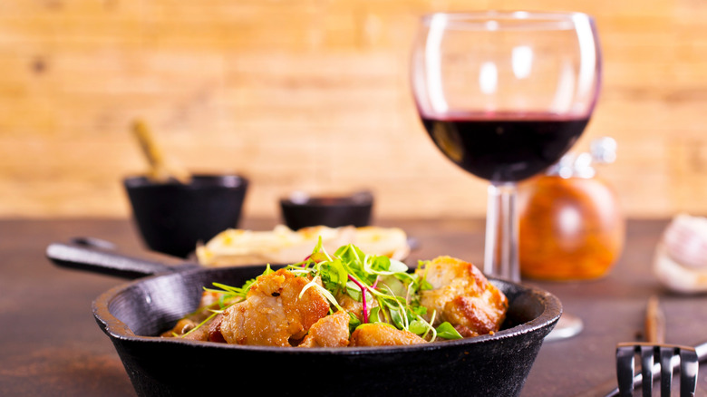 Fried food and a glass of red wine
