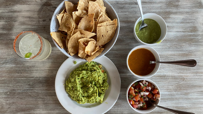 chips, dip and a margarita cocktail