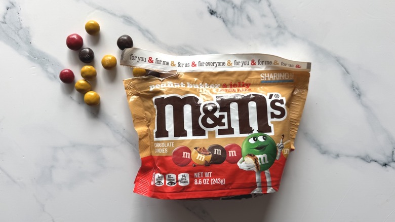 Peanut butter and jelly M&M's on marble surface