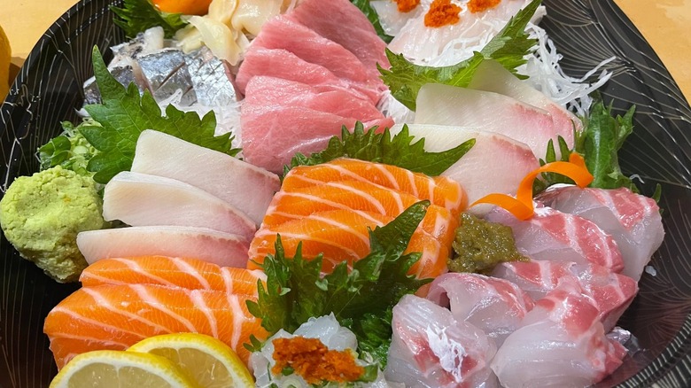 A large platter of various suhi over ice