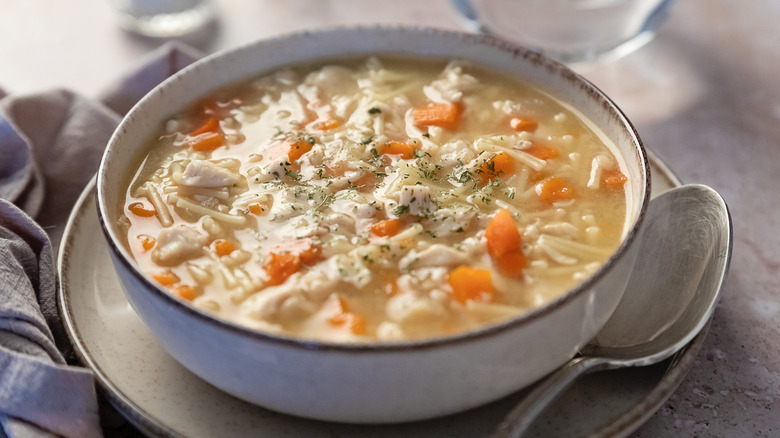 Close up of chicken noodle soup in bowl