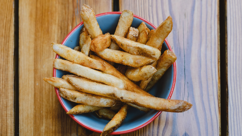 Rustic bowl of restaurant French fries