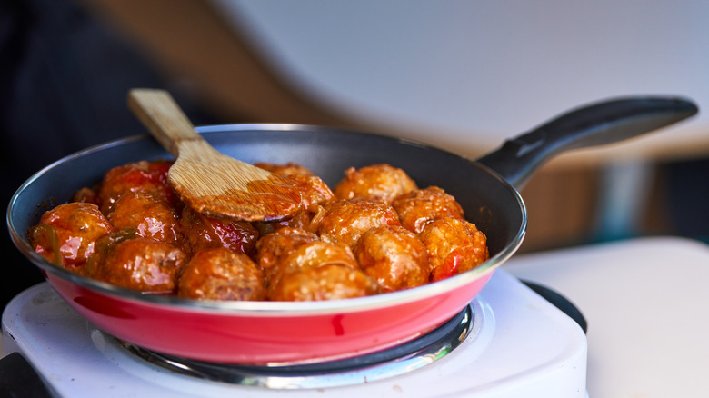 Saucy meatballs in nonstick pan