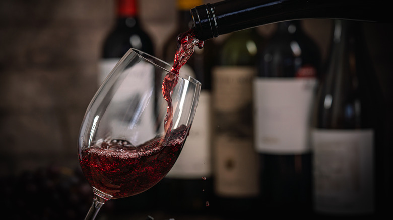 Red wine pouring into a glass