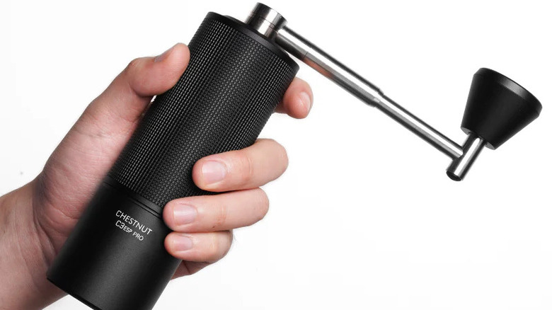 person holding Timemore C3 ESP Pro