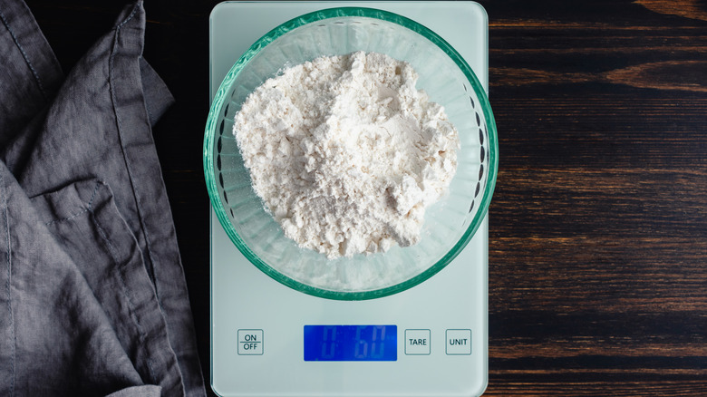 Weighing flour in a bowl on a digital scale