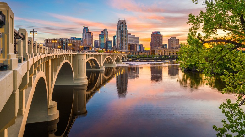 Minneapolis bridge at twilight with downtown skyline in background