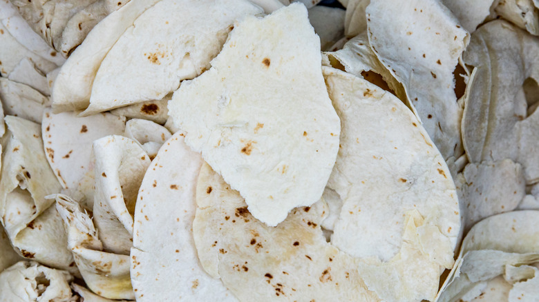 broken tortillas in a bin