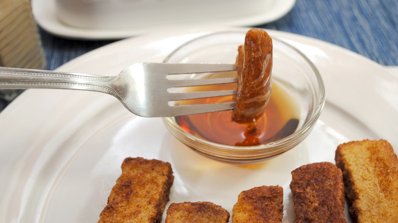 French toast with bowl of maple syrup