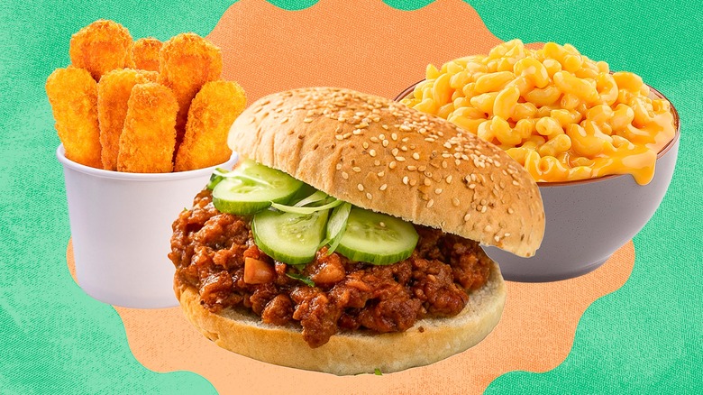 Fish sticks, sloppy Joes, and mac and cheese on green background