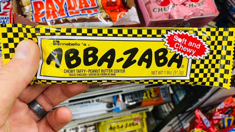 hand holding Abba-Zaba bar