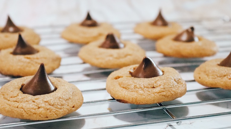 Peanut butter blossoms on a baking tray