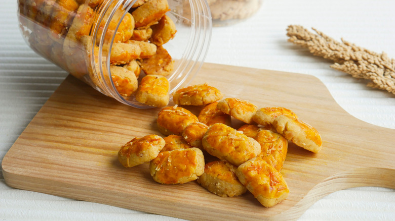 golden cookies spilling out onto a cutting board