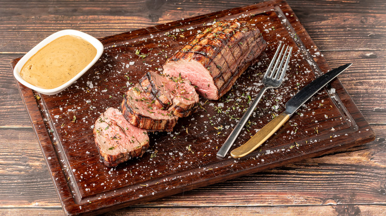 Chateaubriand on surface with sauce