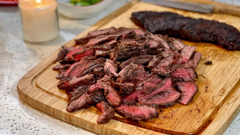 London broil steak sliced on a cutting board