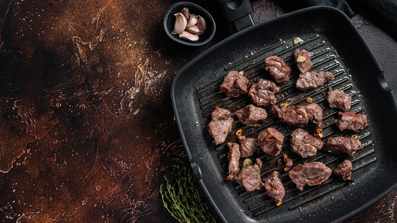 Steak tips on a grill pan