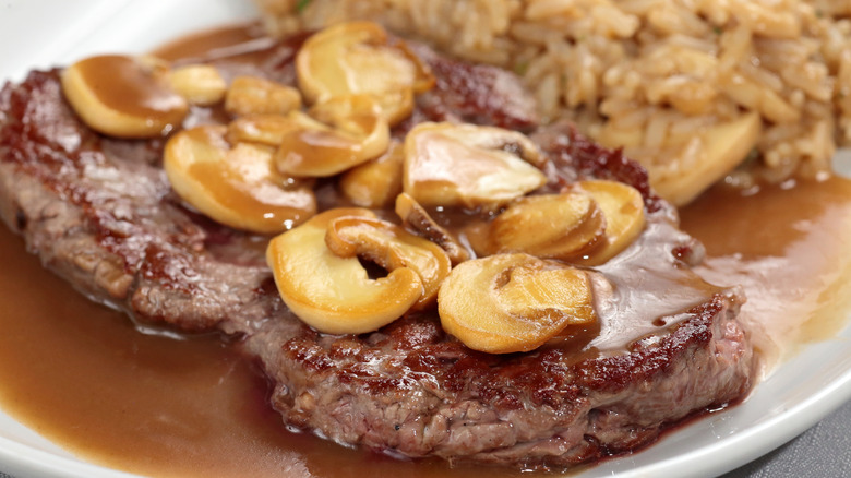 Steak Diane on a plate with risotto
