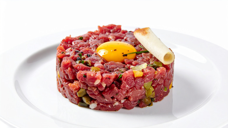 Plate of steak tartare on white dish