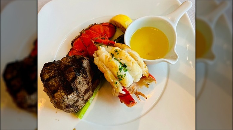 Filet mignon and lobster tail on a plate