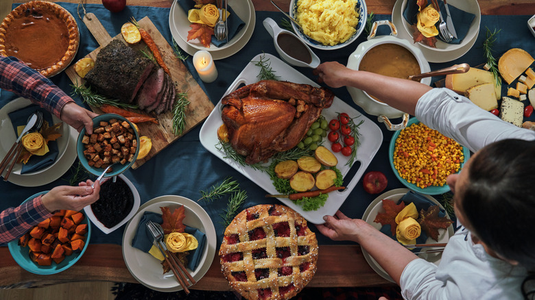 Thanksgiving table with pies and sides