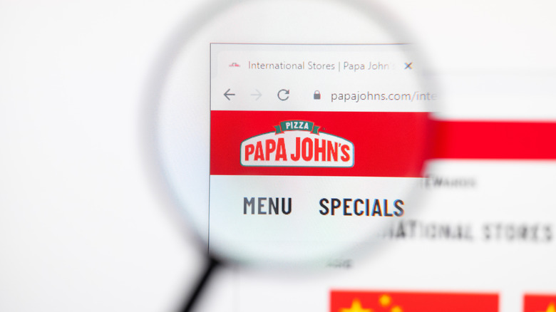 Screen with magnified Papa John's logo on company website