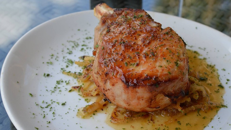A Double-thick Pork Rib Chop on a plate at Fleming's Prime Steakhouse & Wine Bar