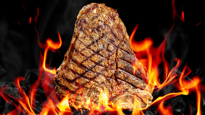 T-bone steak on a fiery grill
