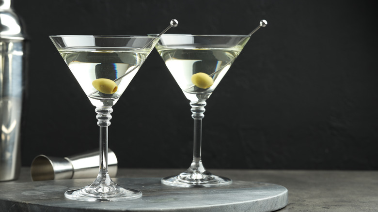 Two martinis with olives