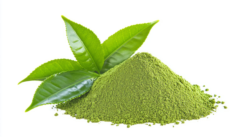 matcha powder and leaf on white background