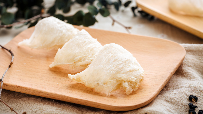 Three pieces of edible bird's nest displayed on a platter