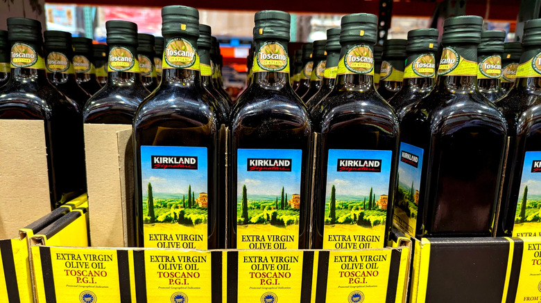Bottles of Kirkland Signature Extra Virgin Olive Oil at a warehouse