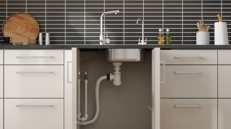 Piping under a kitchen sink