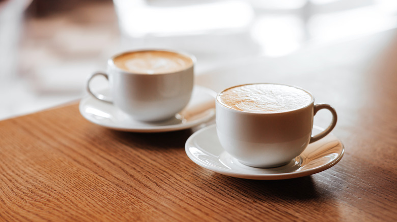Two cups of coffee on a table