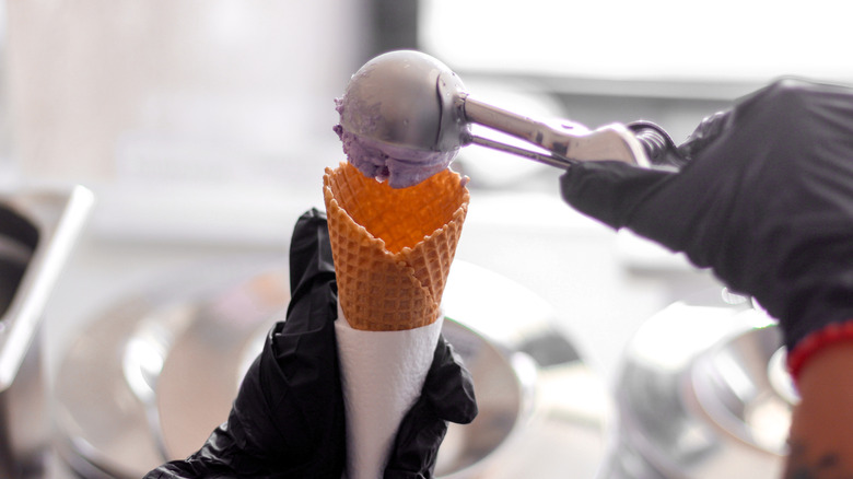 Person scooping gelato into cone