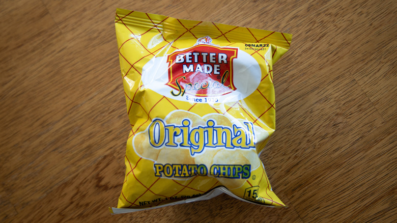 Bag of Better Made Original Potato Chips on wooden table
