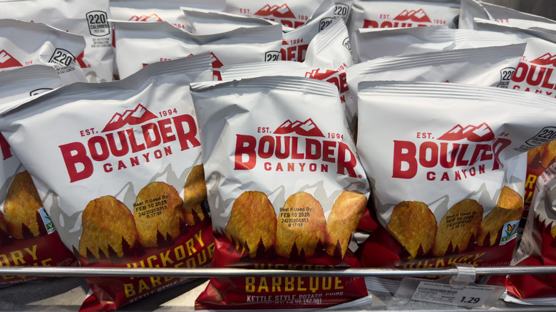 Small bags of Boulder Canyon Hickory Barbecue Potato Chips on display