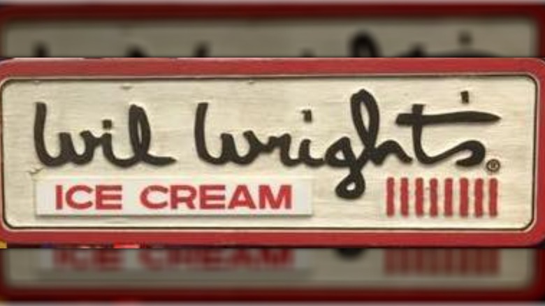 Sign from a Wil Wright's Ice Cream Parlor showing black handwritten-style writing on a white background, outlined in red